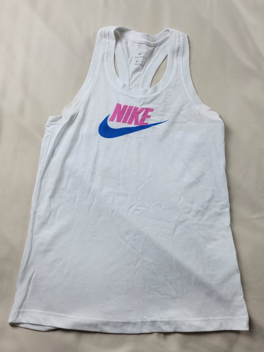 Nike One Classic women's Dri-FIT tank top in white with a blue and pink logo